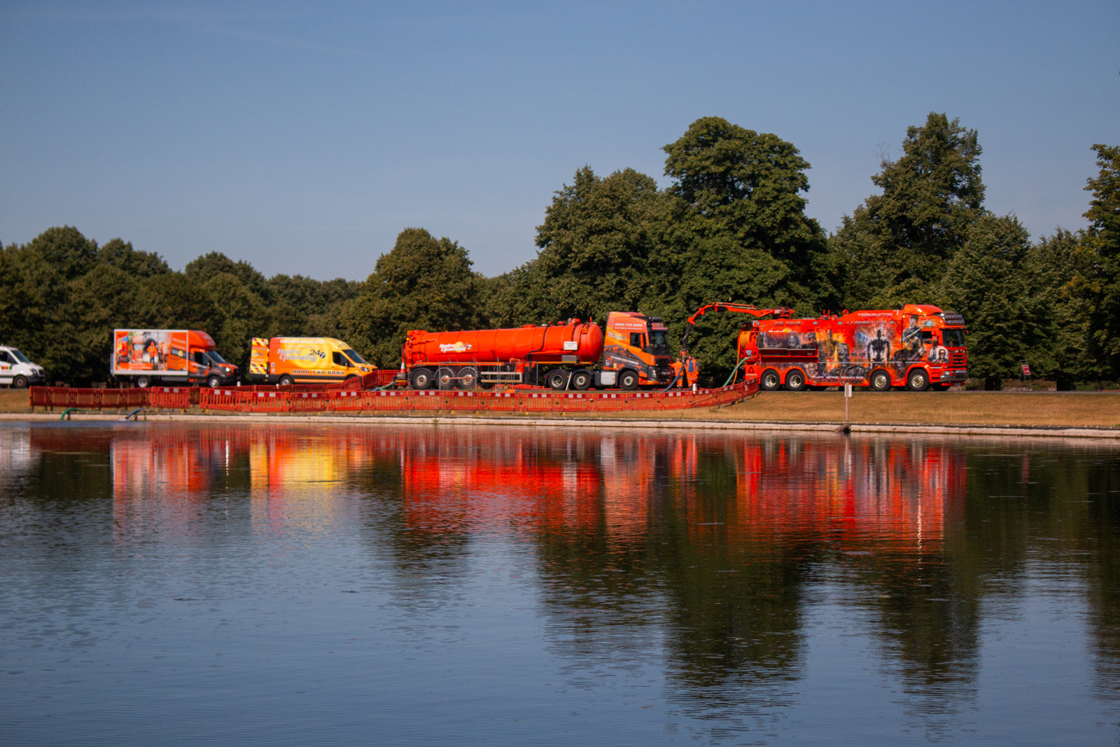 Large articulated bulk tanker removing liquid waste on an industrial site in the UK.