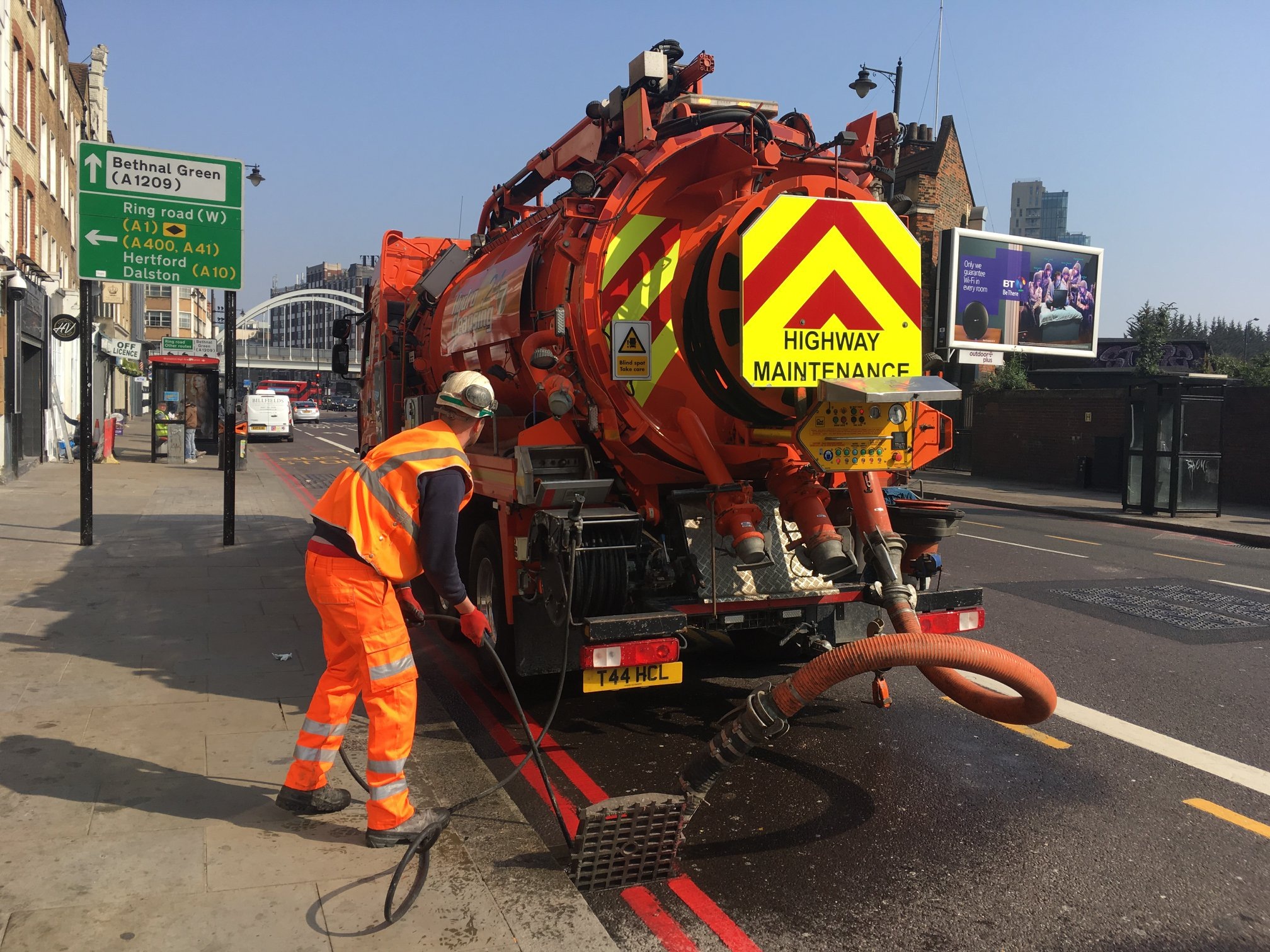 Jetting crew clearing fatberg with high-power hose
